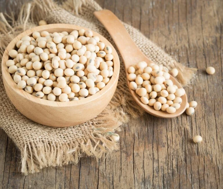 Soybeans-in-wooden-cup-and-wooden-spoon-on-wood-table-768x652